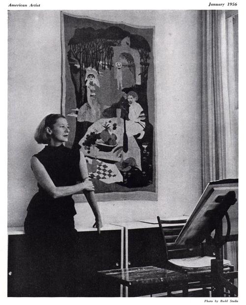 This photo of Evaline Ness at home in her apartment, in front a tapestry she made herself, is from <i>American Artist</i> magazine, January 1956.